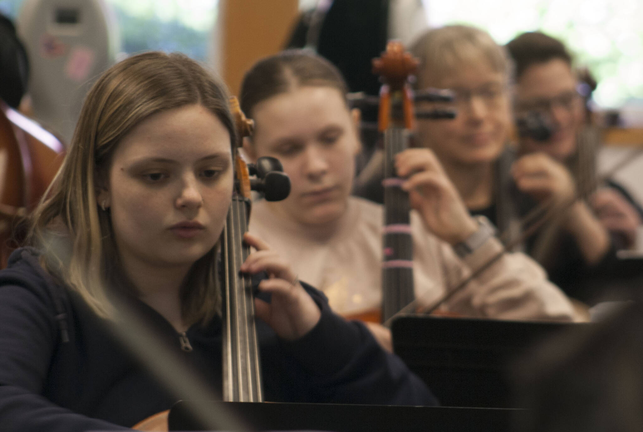 Molly Hetherwick/Kitsap News Group photos
Cellists Olive Leiss, left, May Smaus, Barbara Deppe and Christine Edwards practice at rehearsal April 12.