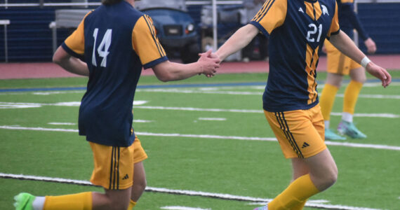 Bainbridge celebrates a 4-0 victory against Sequim.