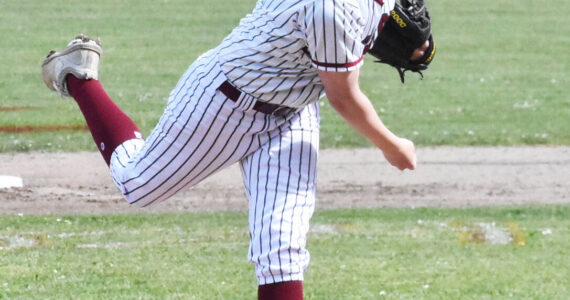 Nicholas Zeller-Singh/Kitsap News Group
Kingston’s Jack Butler pitches against Evergreen.