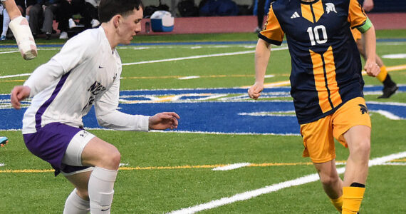 File photos
Spartan Christopher Fowler dribbles past defenders.