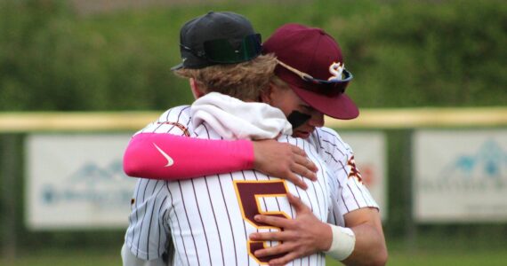 Elisha Meyer/Kitsap News Group photos
Nolan Bayne (5) embraces senior SK teammate Payton Moritz after a home defeat in the district playoffs ends the Wolves’ season.