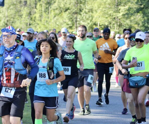 Elisha Meyer/Kitsap News Group photos
A crowd of over 100 runners take their first steps of the half marathon.